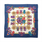 Hermès Carré 90 Les Rubans du Cheval silk scarf with navy border, ivory center, multicolor ribbon rosettes, bows and gold harness motifs.
