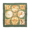 Hermès Carré 90 green silk scarf with illustrated seasonal woodland scenes featuring squirrels, birds, deer, trees and floral details.