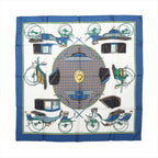 Hermès Les Voitures à Transformation silk scarf with blue border, ivory center and illustrated carriages in blue, green, black and gold.