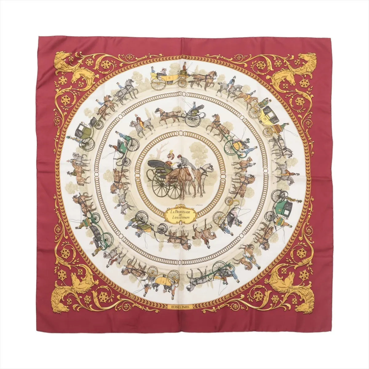 Hermès La Promenade de Longchamps silk scarf with burgundy border, ivory center, horse-drawn carriage illustrations and ornate gold motifs.