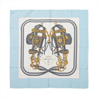 Hermès Brides de Gala silk scarf with light blue border, ivory center, gray equestrian bridles and ornate gold hardware details.