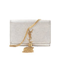 Saint Laurent Kate Small crossbody bag in metallic glitter gold with gold-tone YSL monogram, gold chain strap and tassel detail on white background.
